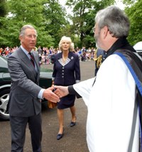 The Rev Paul Redfern greets the Prince and Duchess.